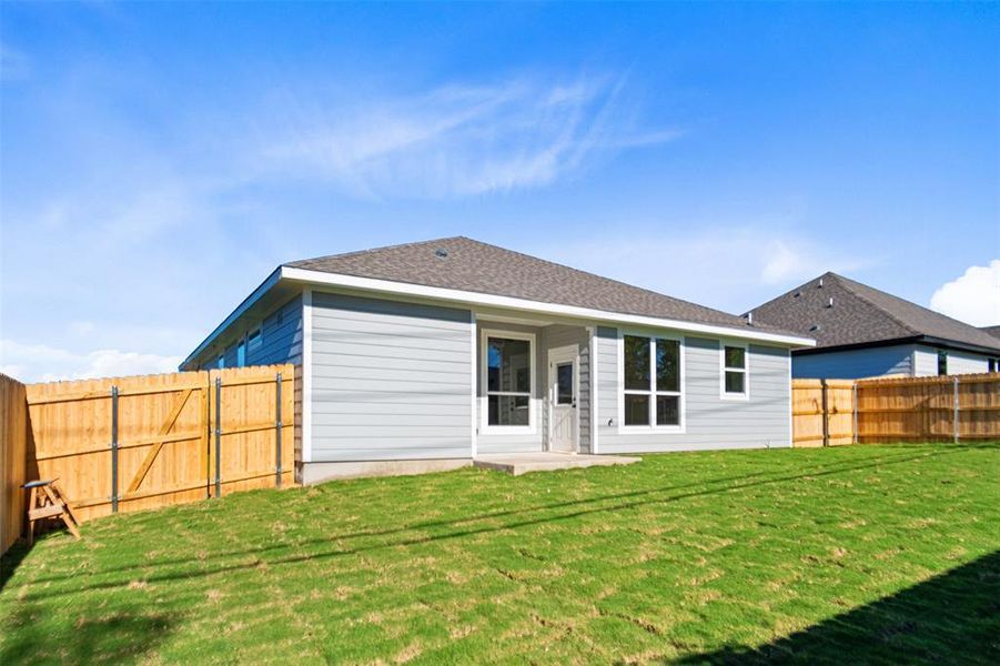 Rear view of property featuring a patio area Rear view of property featuring a patio area