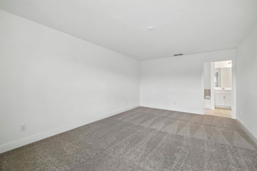 Representative unfurnished interior of a home built from the Wilshire Executive by Landsea Homes in Storey Creek, Kissimmee (Image 11).