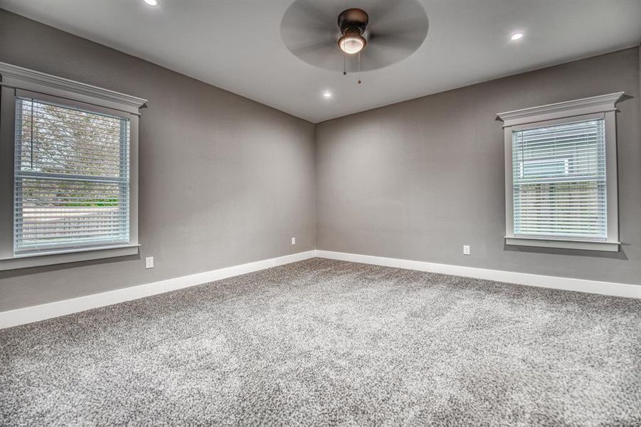 Unfurnished room featuring light colored carpet, recessed lighting, and ceiling fan