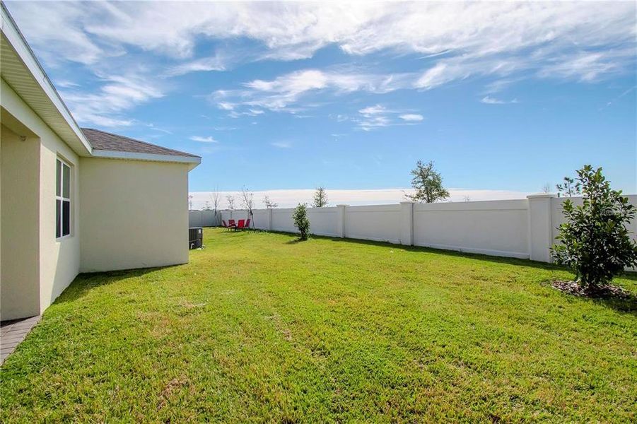 Exterior details and patio area of a home in Tohoqua Reserve, Kissimmee (Image 24).