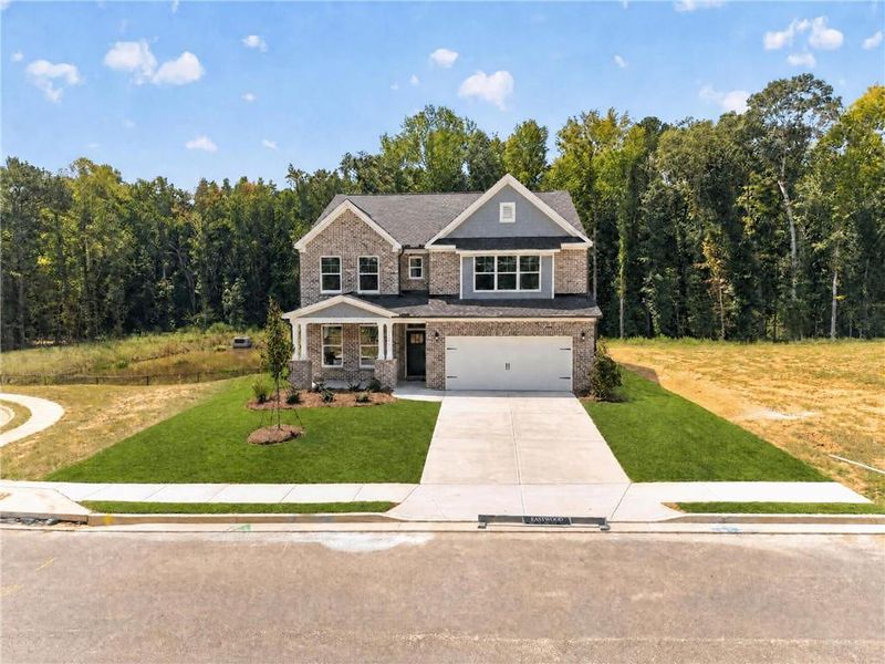 Front exterior of a new home in , Loganville, GA, highlighting curb appeal (Image 28). Front exterior of a new home in , Loganville, GA, highlighting curb appeal (Image 28).