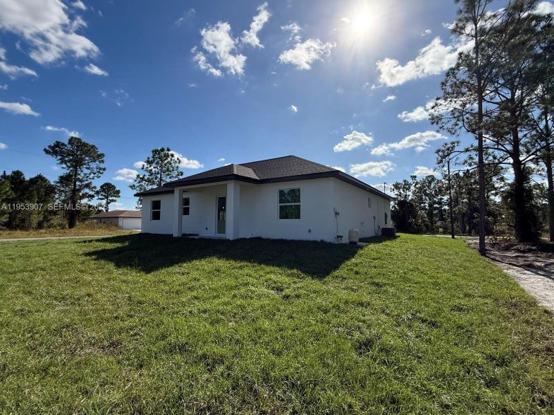 Exterior details and patio area of a home in , Lehigh Acres (Image 19). Exterior details and patio area of a home in , Lehigh Acres (Image 19).