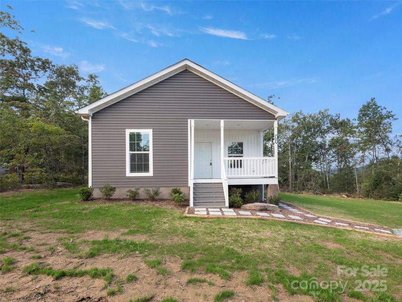 Front exterior of a new home in , Hendersonville, NC, highlighting curb appeal (Image 1).