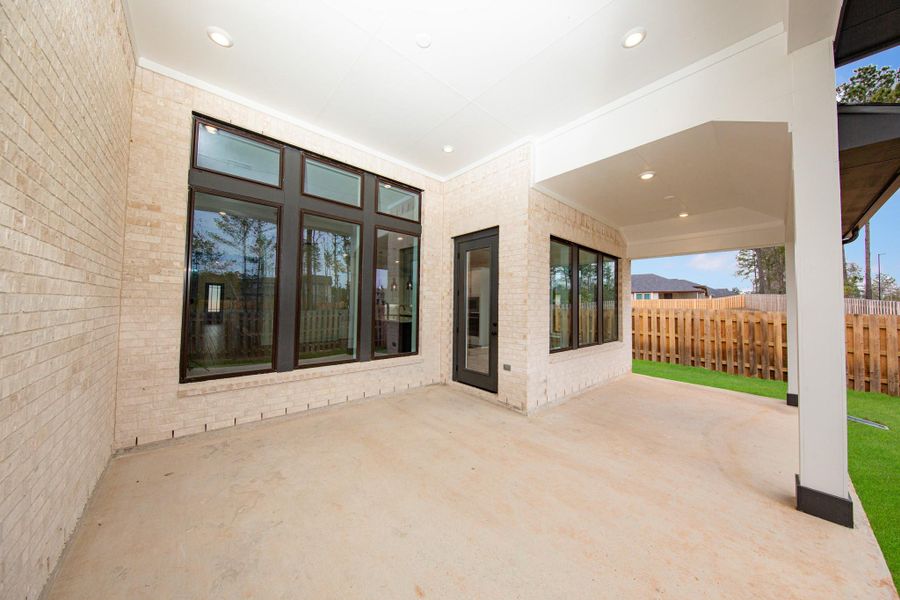 Step outside to the covered rear patio, the perfect extension of your indoor living space for year-round enjoyment.