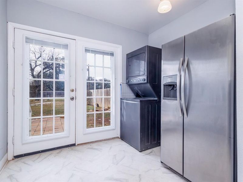 Refrigerator and washer/dryer will remain on request.  Door leads to large backyard