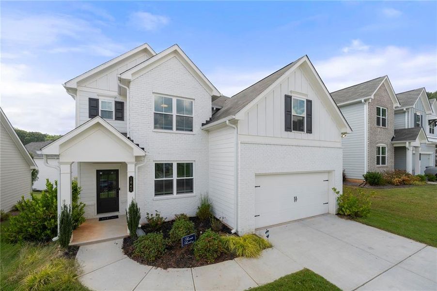 Front exterior of a new home in Avenbrook, Mableton, GA, highlighting curb appeal (Image 20).