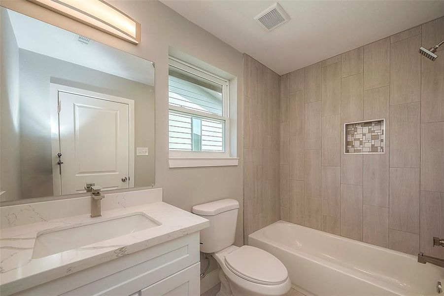 Hall bathroom with tub to ceiling tile