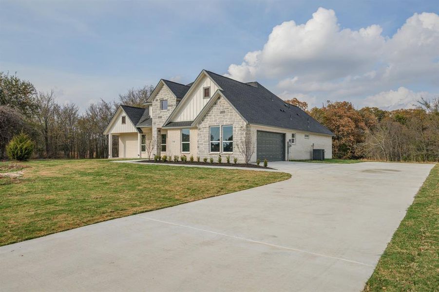 Front exterior of a new home in , Terrell, TX, highlighting curb appeal (Image 22).