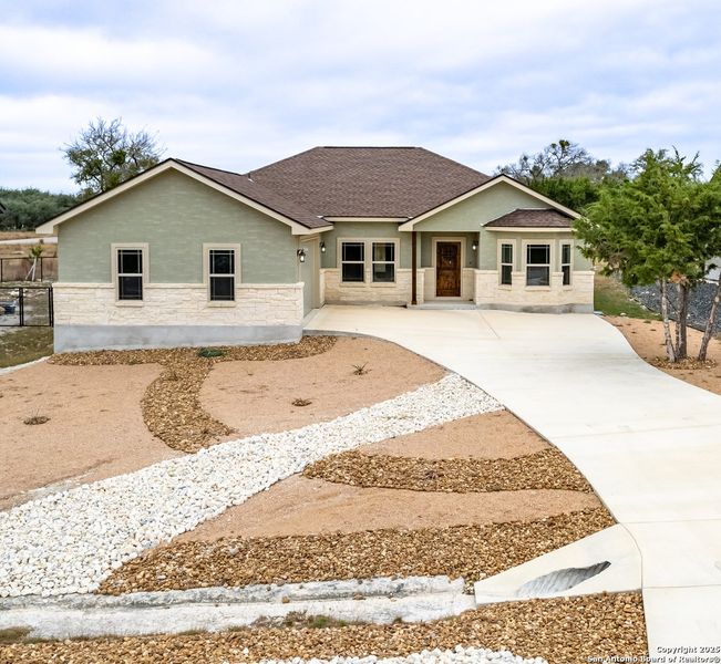 Front exterior of a new home in , Blanco, TX, highlighting curb appeal (Image 20). Front exterior of a new home in , Blanco, TX, highlighting curb appeal (Image 20).