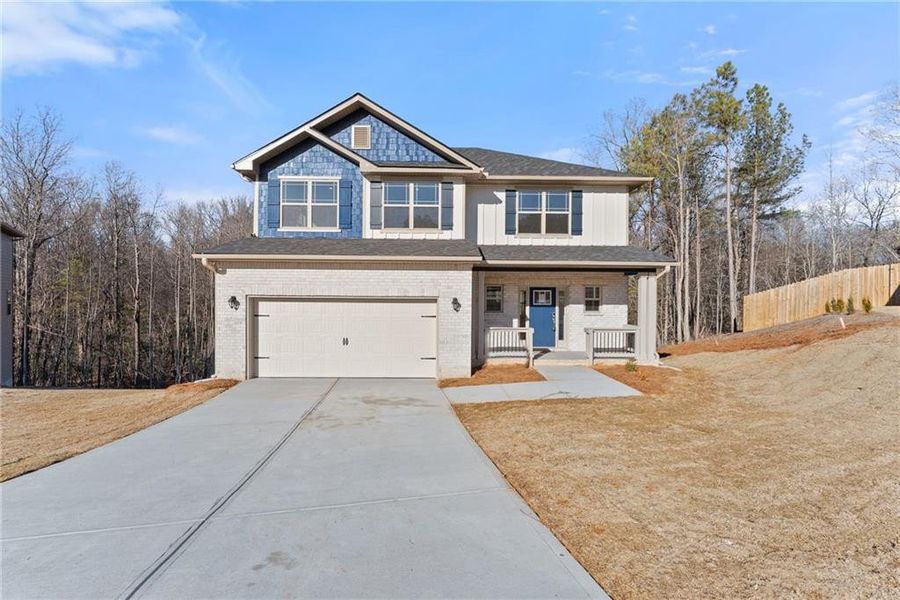 Front exterior of a new home in Magnolia Villas, Cornelia, GA, highlighting curb appeal (Image 22).