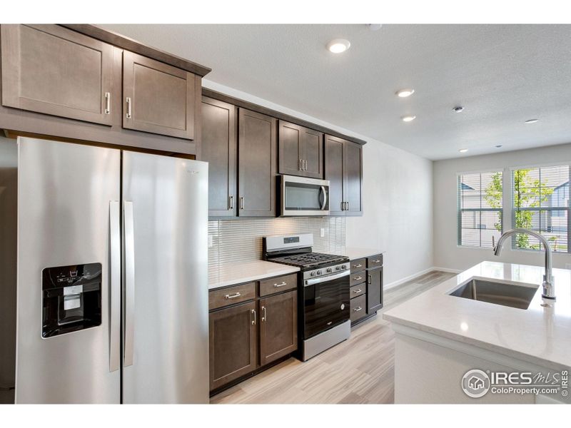Furnished interior view inside a new home in Westside Crossing Townhomes, Berthoud (Image 10).
