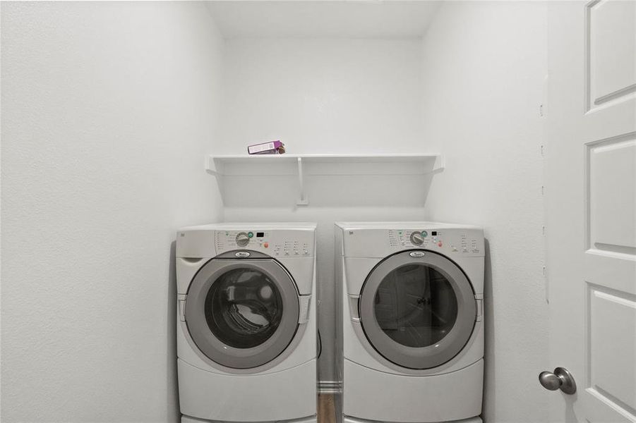 Laundry area featuring independent washer and dryer