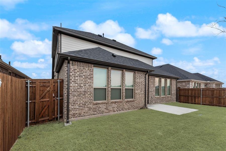Exterior details and patio area of a home in Walden Pond, Forney (Image 23).