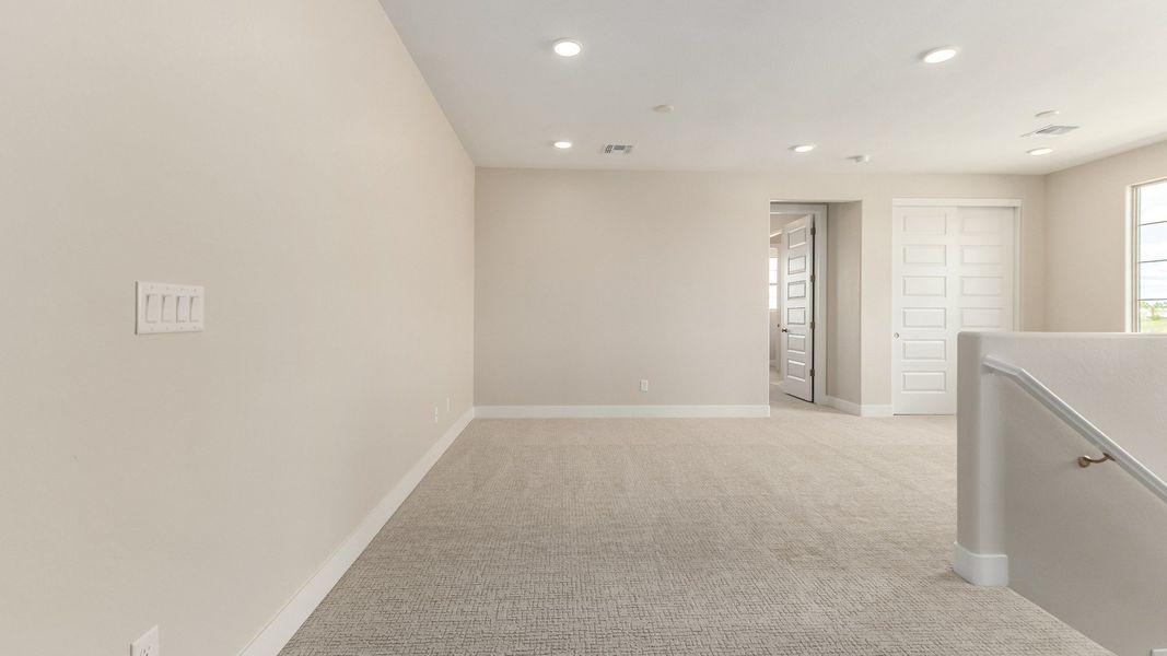 Representative furnished interior of a home built from the The Delaney by DRB Homes in Surprise City Center, Surprise (Image 21).