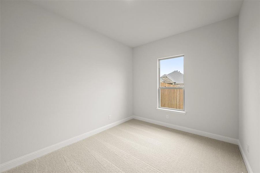 Spare room with light carpet