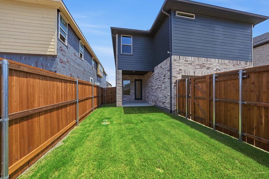 Exterior details and patio area of a home in Light Farms Brenham - 40' Lots, Celina (Image 4).