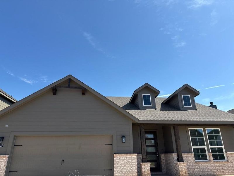 Front exterior of a new home in Covenant Park, Springtown, TX, highlighting curb appeal (Image 2). Front exterior of a new home in Covenant Park, Springtown, TX, highlighting curb appeal (Image 2).