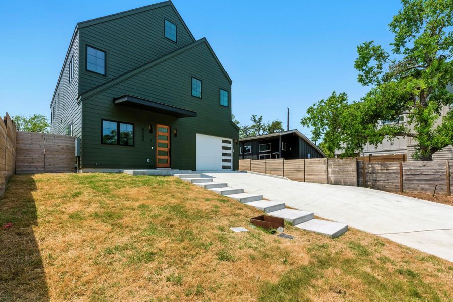Front exterior of a new home in , Austin, TX, highlighting curb appeal (Image 26). Front exterior of a new home in , Austin, TX, highlighting curb appeal (Image 26).