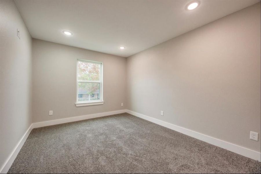 Spare room with carpet floors and recessed lighting