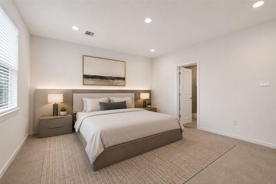 Spacious primary bedroom featuring carpeted flooring, recessed lighting, abundant natural light, and views overlooking the backyard. Private retreat with direct access to the primary bathroom. Virtually staged to illustrate room scale and furnishing possibilities.