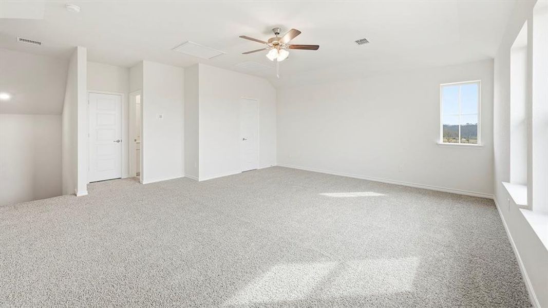 Unfurnished bedroom featuring carpet and a ceiling fan