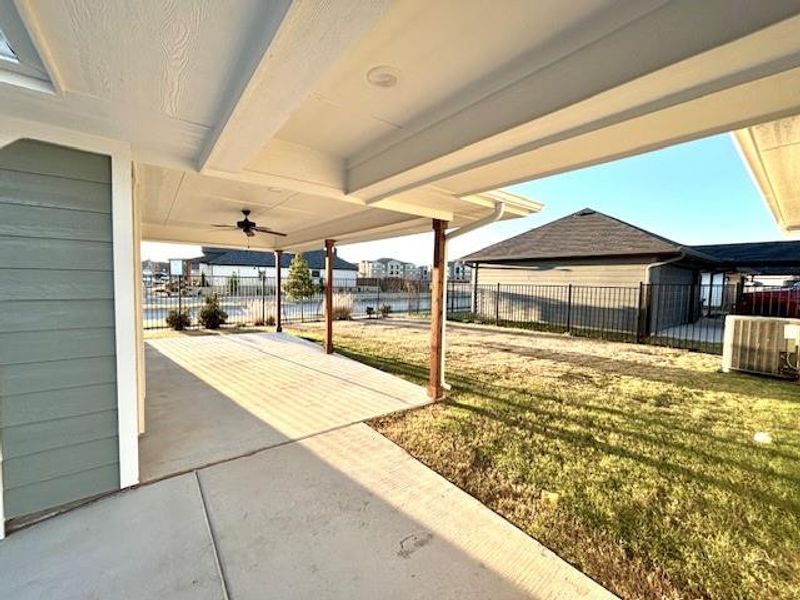 View of yard featuring a patio area and ceiling fan