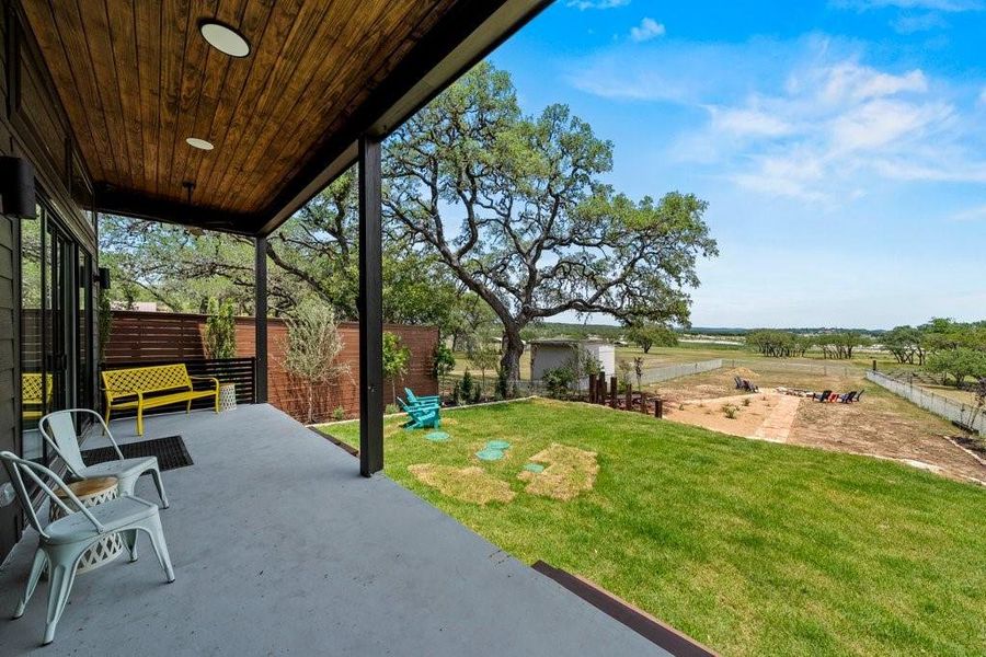 Unwind on the covered back patio with peaceful Hill Country views and a spacious yard perfect for entertaining or soaking in the Canyon Lake breeze. A serene setting for morning coffee or evening sunsets.