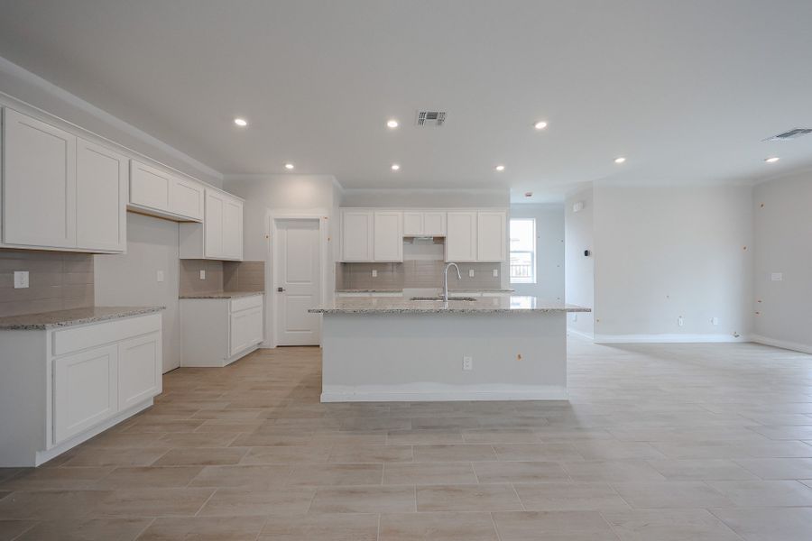 A kitchen with white cabinets. A kitchen with white cabinets.