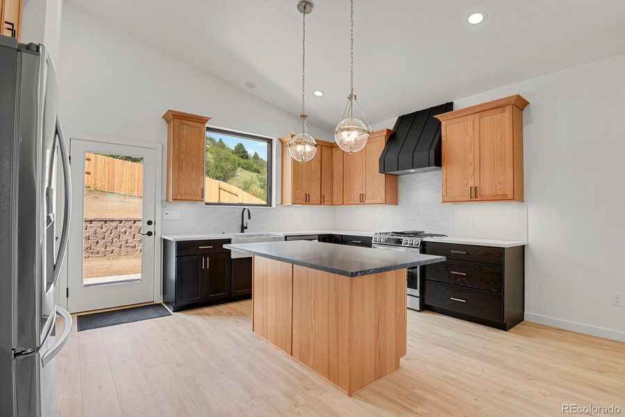 Quartz counters, center island, farmhouse Carrara marble sink and backsplash Quartz counters, center island, farmhouse Carrara marble sink and backsplash