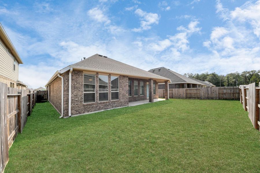 Exterior details and patio area of a home in Tavola: Fairway Collection, New Caney (Image 3).