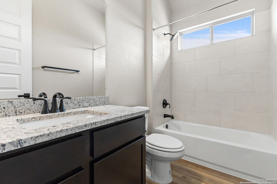 Furnished interior view inside a new home in The Enclave at Potranco Oaks, Castroville (Image 11).