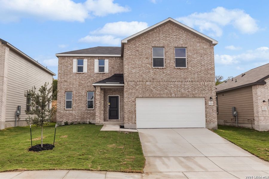 Front exterior of a new home in Hidden Bluffs at TRP, San Antonio, TX, highlighting curb appeal (Image 19).