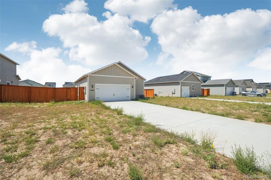 Front exterior of a new home in Wolf Creek Run, Strasburg, CO, highlighting curb appeal (Image 2).