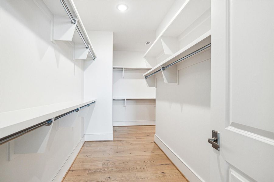 Huge Walk-in primary dressing room. Photos are of a similar unit with the same floor plan