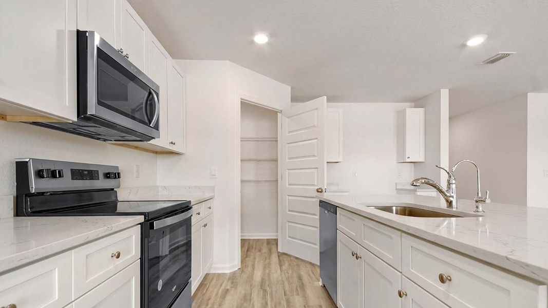 Furnished interior view inside a new home in Ashton Park Phase III, Freeport (Image 3).
