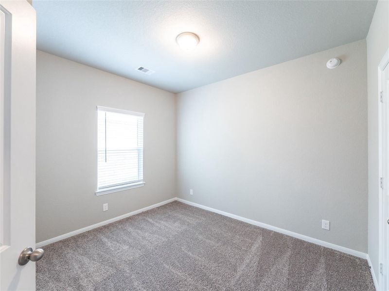 Spacious, unfurnished interior of a new home in Sweetgrass Village, Crosby (Image 11).