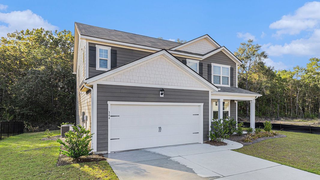 Front exterior of a new home in Auberon Woods, Conway, SC, highlighting curb appeal (Image 2). Front exterior of a new home in Auberon Woods, Conway, SC, highlighting curb appeal (Image 2).