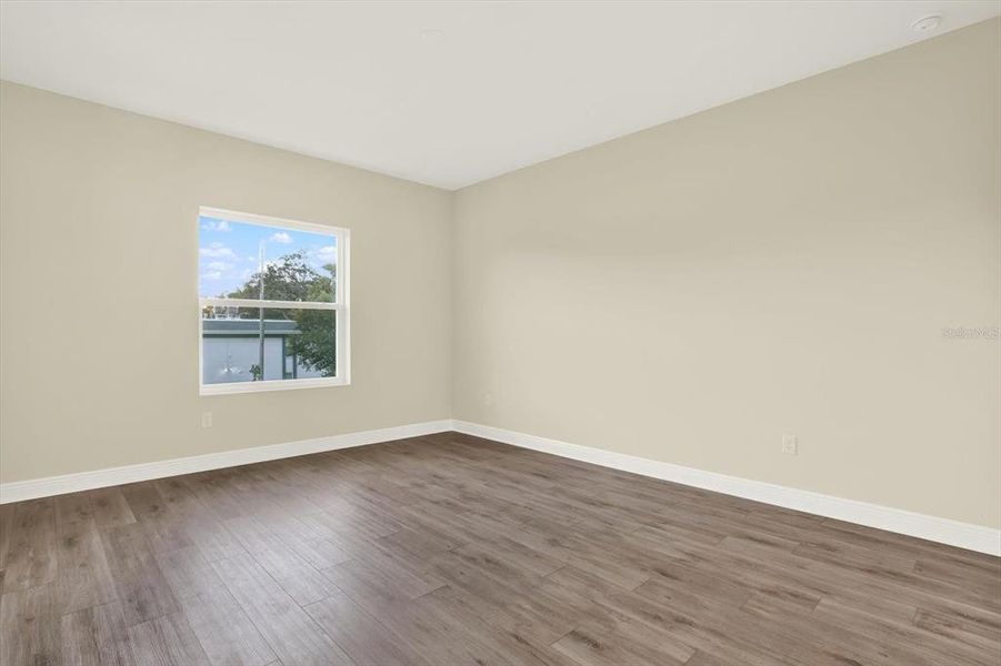 Spacious, unfurnished interior of a new home in The Towns At Long Bayou, Seminole (Image 15).