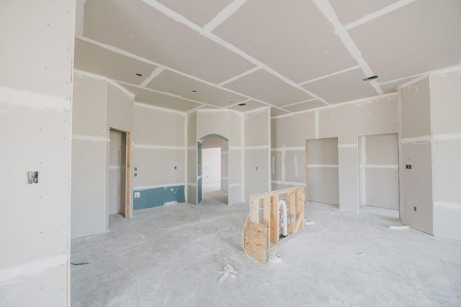 Empty room featuring arched walkways Empty room featuring arched walkways