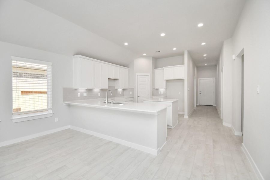 This generously spacious kitchen is a dream realized! Sample photo of completed home with similar floor plan. Actual colors and selections may vary.