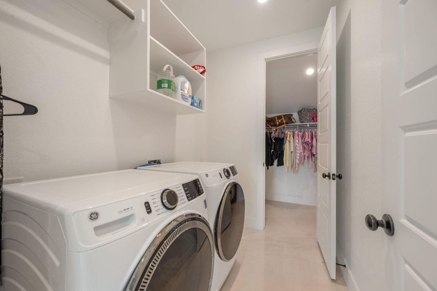 A dedicated laundry space offers practical convenience with essential appliances and clever storage solutions. A dedicated laundry space offers practical convenience with essential appliances and clever storage solutions.