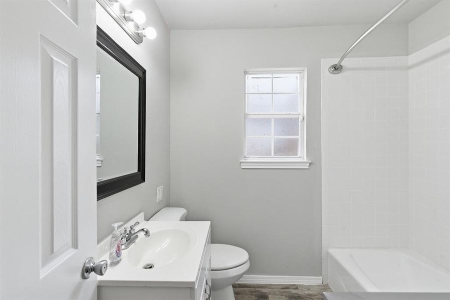 Full bath featuring vanity and bathtub / shower combination Full bath featuring vanity and bathtub / shower combination