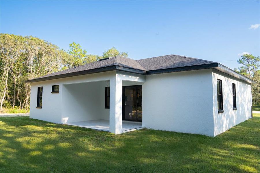 Exterior details and patio area of a home in , Brooksville (Image 16).