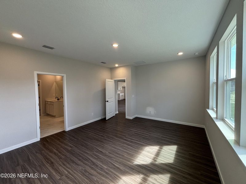 Spacious, unfurnished interior of a new home in The Cypress Series at Reserve East, Flagler Beach (Image 24).