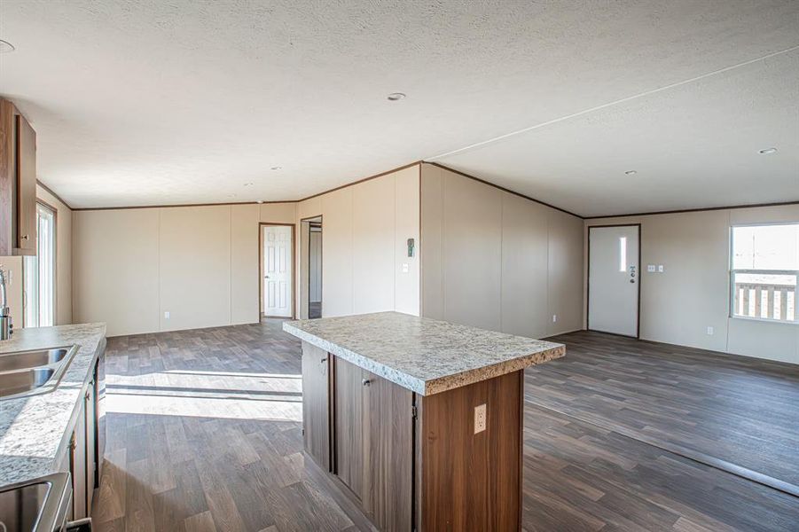 Kitchen with a kitchen island and recessed