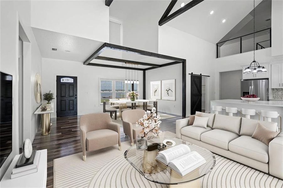 This living room is spacious and well-lit, with a large window featuring a wooden beam and a rectangular light fixture