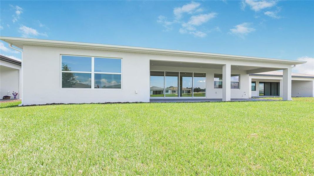 Exterior details and patio area of a home in Woodland Preserve, Parrish (Image 28).