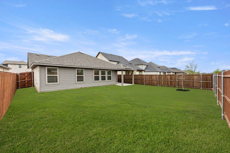 Representative exterior photo of a completed home built from the Cheyenne by Impression Homes in DeBerry Reserve, Royse City, TX (Image 26).