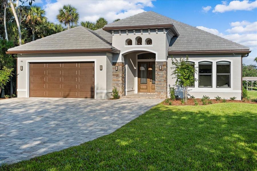 Front exterior of a new home in , Palm Coast, FL, highlighting curb appeal (Image 27).