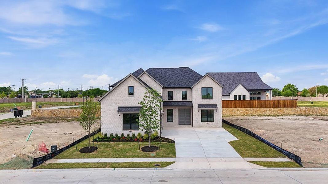 Front exterior of a new home in Custer Ridge Estates, Allen, TX, highlighting curb appeal (Image 26).